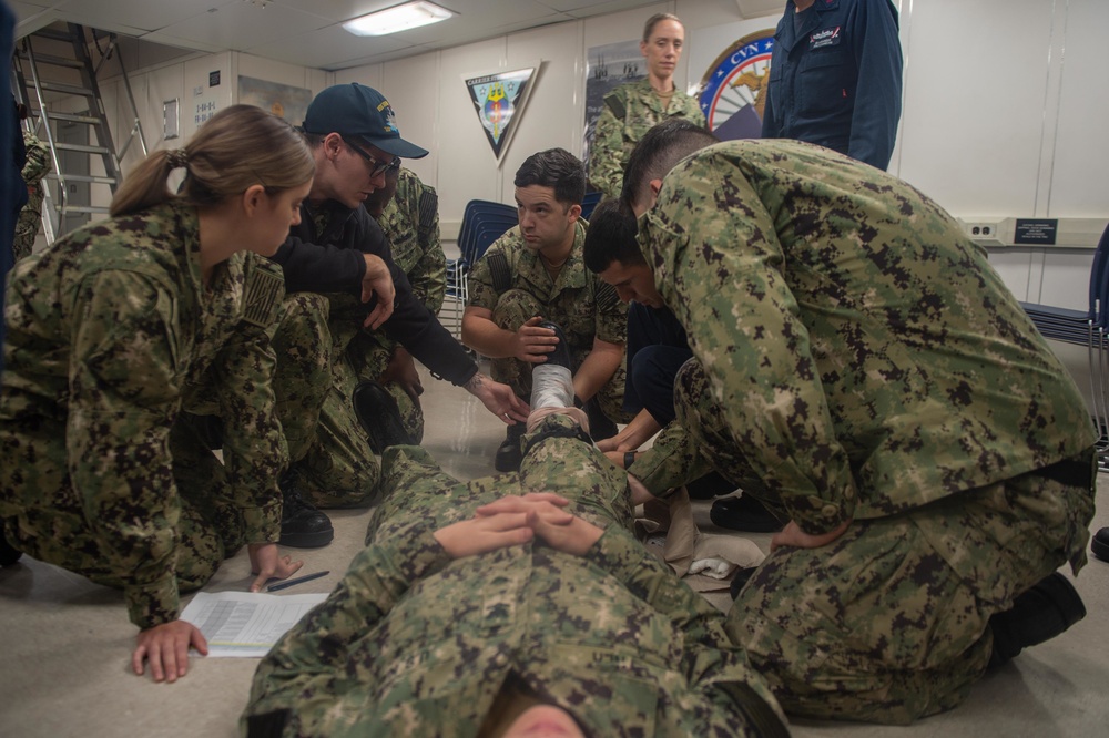 U.S. Navy Sailors practice first-aid