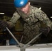 U.S. Sailor bands together metal beams