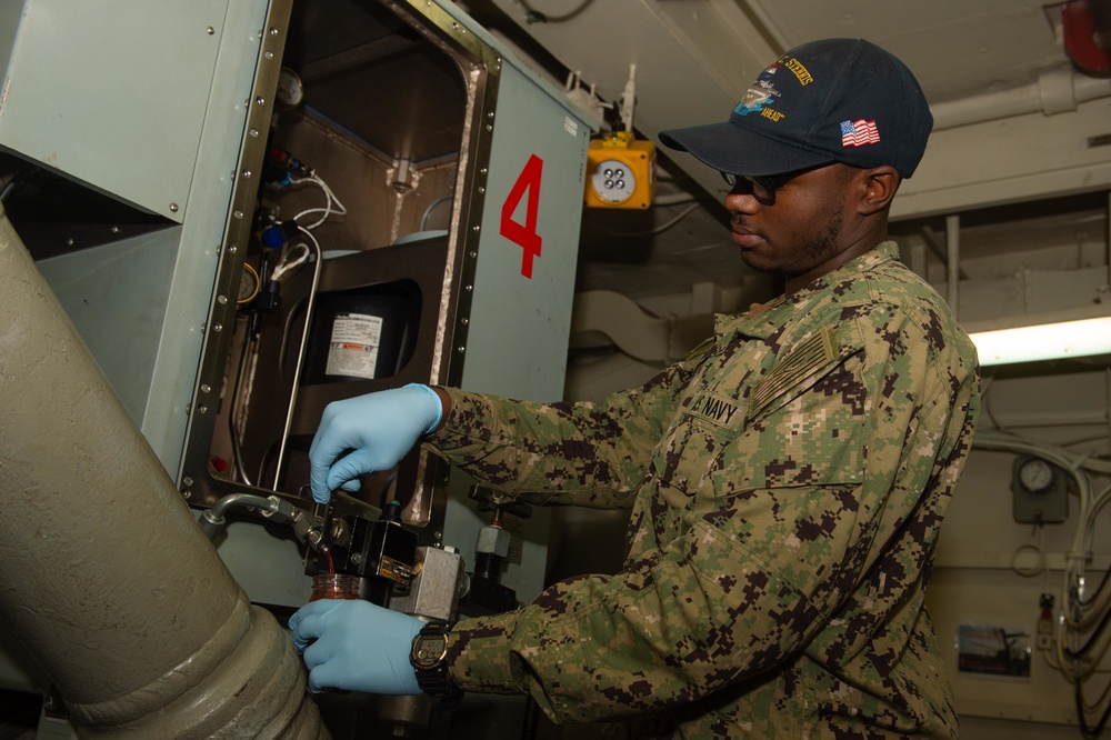 Sailor conducts maintenance