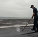 U.S. Sailor cleans padeye