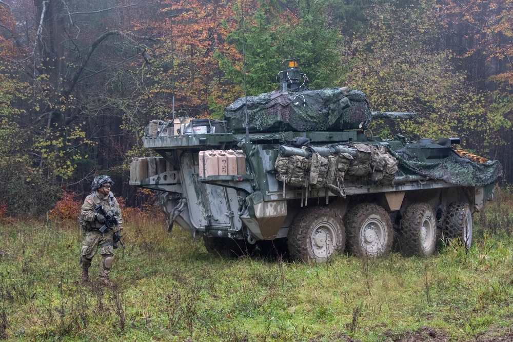 A Soldier dismounts from his Stryker Infantry Carrier Vehicle 
