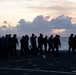 U.S. Sailors conduct a foreign object debris walkdown on the flight deck