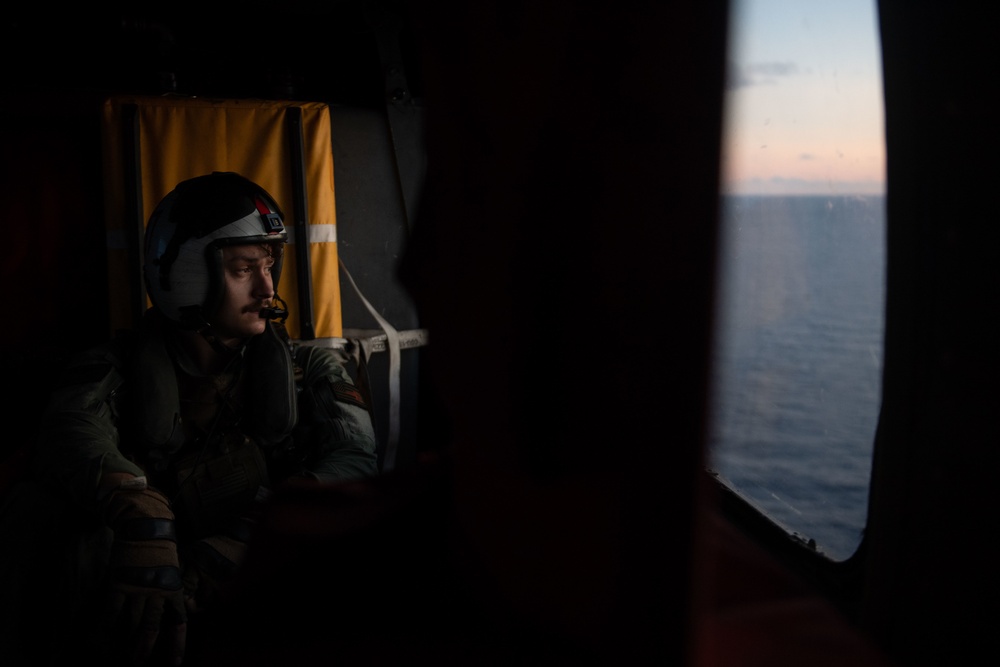 U.S. Navy Naval Aircrewman  takes off