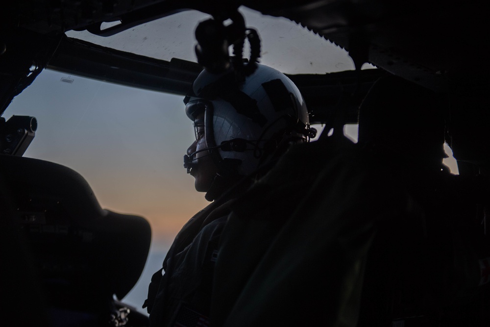 U.S. Navy Lt. operates an MH-60S Sea Hawk in the Atlantic Ocean