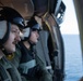 U.S. Navy Naval Aircrewmen prepare to land on the aircraft carrier USS John C. Stennis (CVN 74)