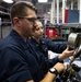 U.S. Sailors calibrate equpiment