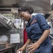 USS McCampbell Sailors prepare meals
