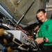 USS Normandy Sailor Conducts Daily Check On MH-60R Sea Hawk Helicopter