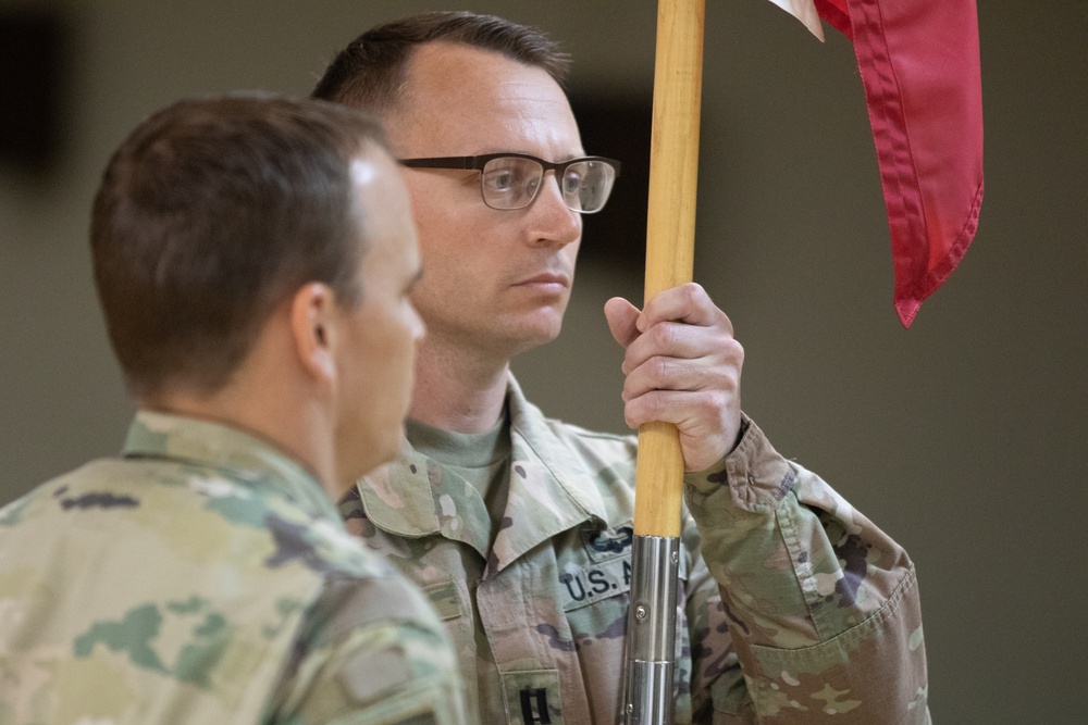 Capt. Corbin Barber receives the guidon for Fox Company