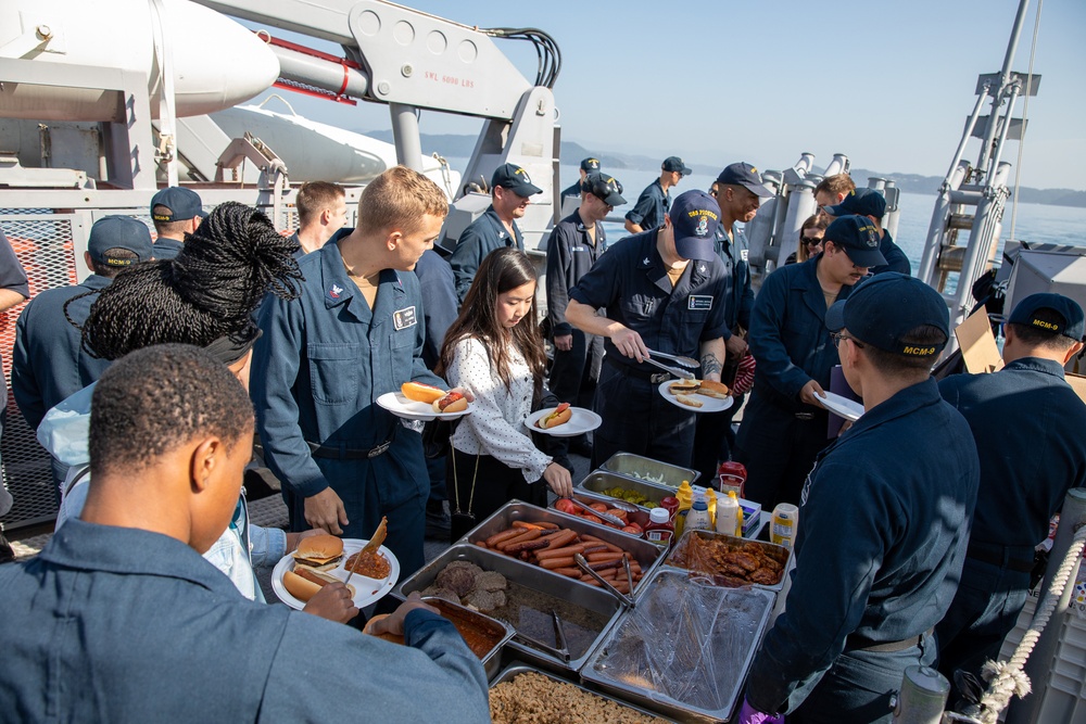 USS Pioneer sails around Sasebo harbor for Family and Friends Day cruise