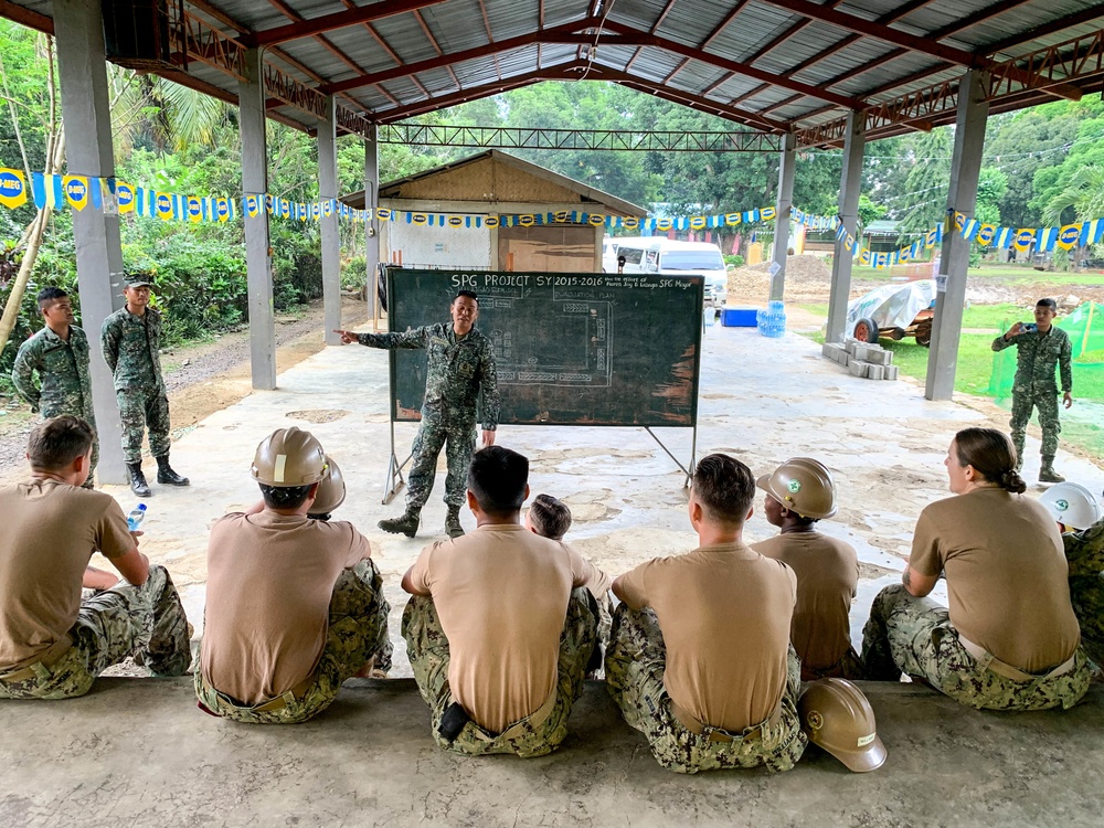 Seabees deployed with Naval Mobile Construction Battalion (NMCB) 5’s Detail Palawan prepare for construction at Malatgao Elementary School