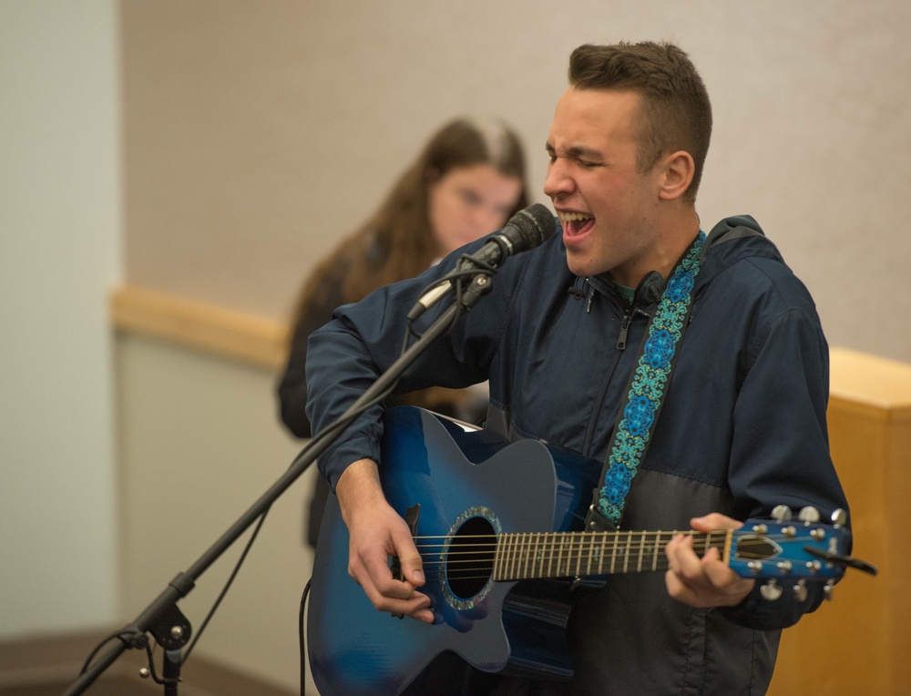 Whiteman AFB Airman sings during the inaugural resilience Kick Back Day