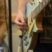 The Squeaks singer Daniel Baldwin strums a guitar at the inaugural Kick Back Day at Whiteman AFB