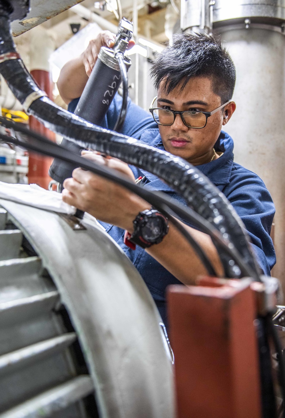 Sailors Aboard USS Milius (DDG 69) Maintain a Fire Pump