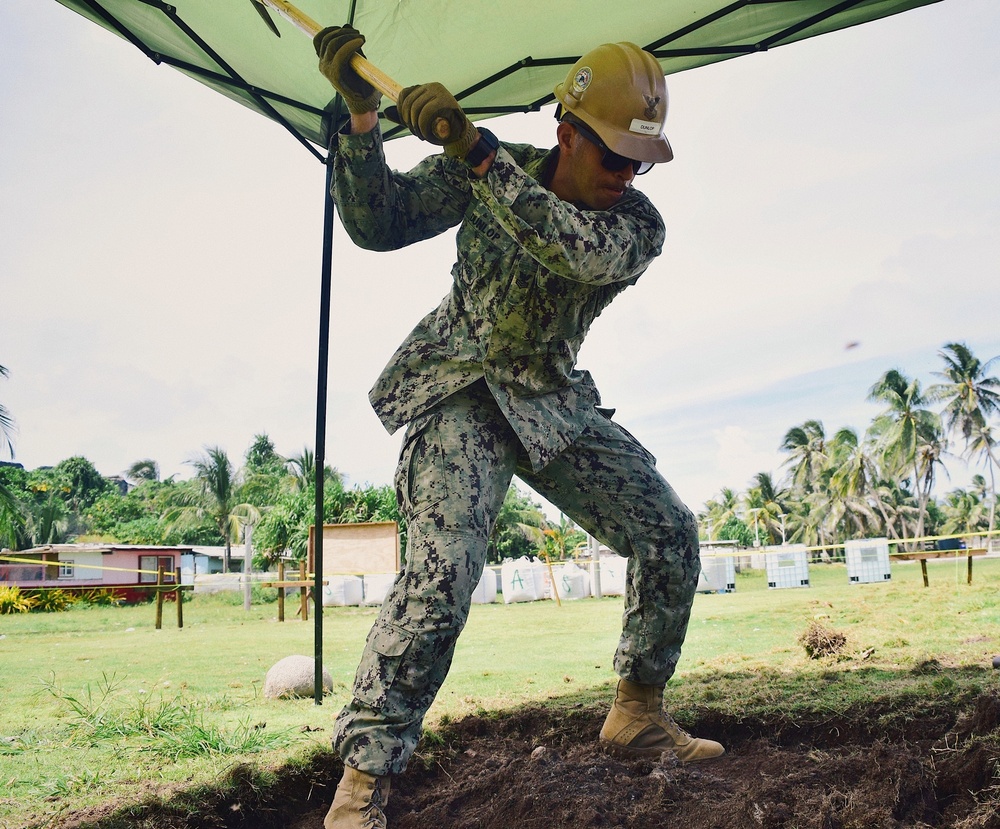 Seabees deployed with Naval Mobile Construction Battalion 5's Detail Marshall Islands start on Ennibur Evacuation Center project site