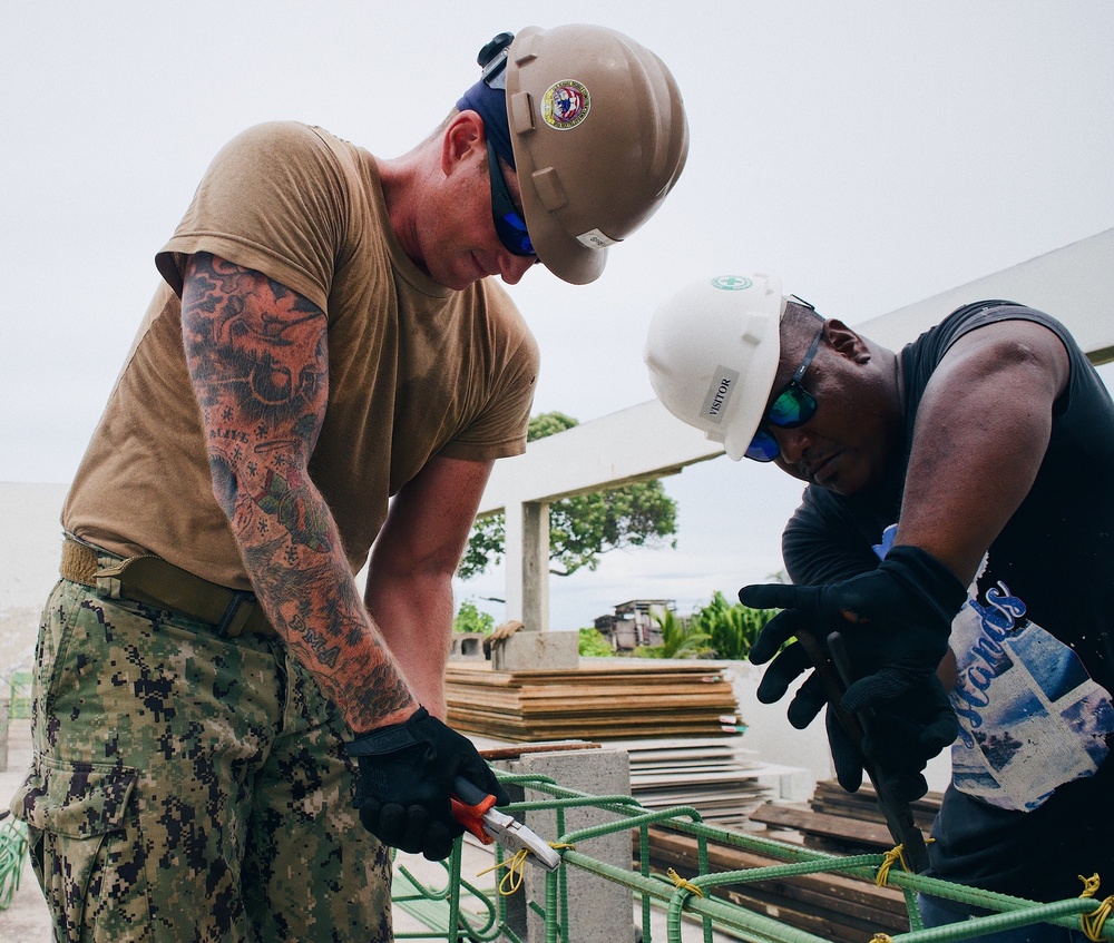 Seabees deployed with Naval Mobile Construction Battalion 5's Detail Marshall Islands start on Ennibur Evacuation Center project site