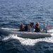 USS Normandy Sailors Ride In RHIB During Swim Call