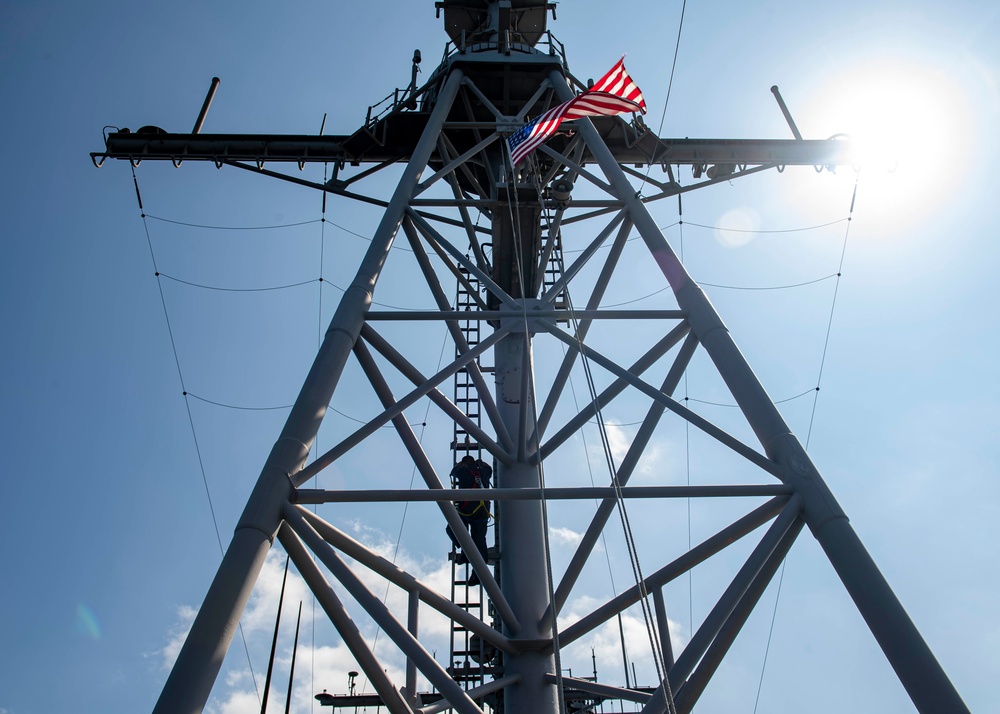 USS Normandy Sailor Climbs Main Mast