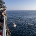 USS Normandy Sailors Swim Beside Ship