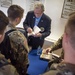 Medal of Honor recipient Patrick Brady signs books for ROTC cadets