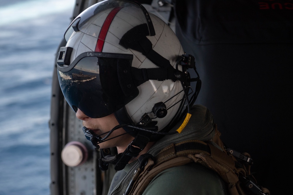 U.S. Navy Naval Aircrewman prepares to land on the aircraft carrier USS John C. Stennis (CVN 74)