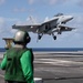 U.S. Navy Aviation Boatswain's Mate (Handling) Airman Apprentice Chris Blaisdell, from Lancaster, California, awaits An F/A-18F Super Hornet