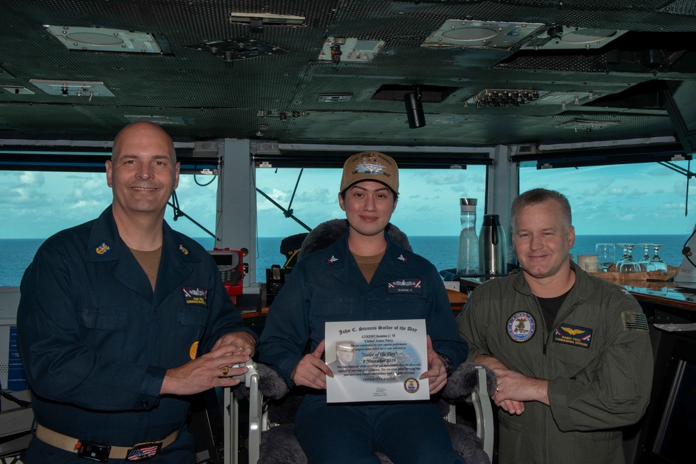 U.S. Navy Logistics Specialist 3rd Class Jasmine Yi, from Dallas, poses for a photograph as the Sailor of the Day