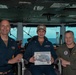 U.S. Navy Logistics Specialist 3rd Class Jasmine Yi, from Dallas, poses for a photograph as the Sailor of the Day