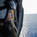 U.S Navy Naval Aircrew Man monitors flight activity from the cabin of an MH-60S Sea Hawk in the Atlantic Ocean