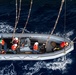 U.S. Sailors operate a rigid-hull inflatable boat