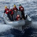 U.S. Sailors operate a rigid-hull inflatable boat