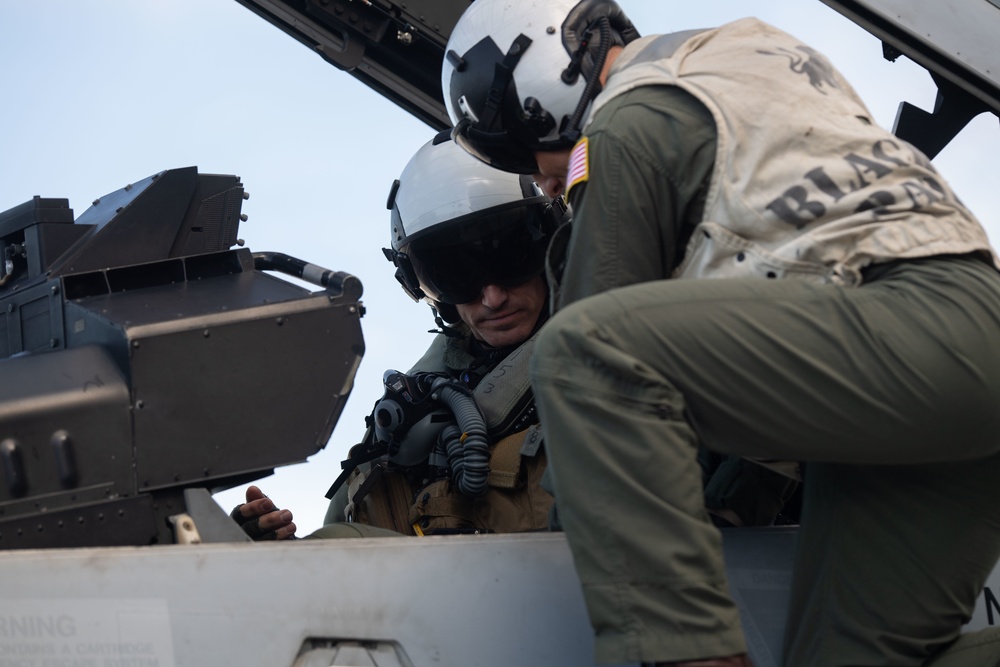 U.S. Navy Capt. Matthew Bolls, supply officer aboard the aircraft carrier USS John C. Stennis (CVN 74), prepares for a flight in an F/A-18F Super Hornet