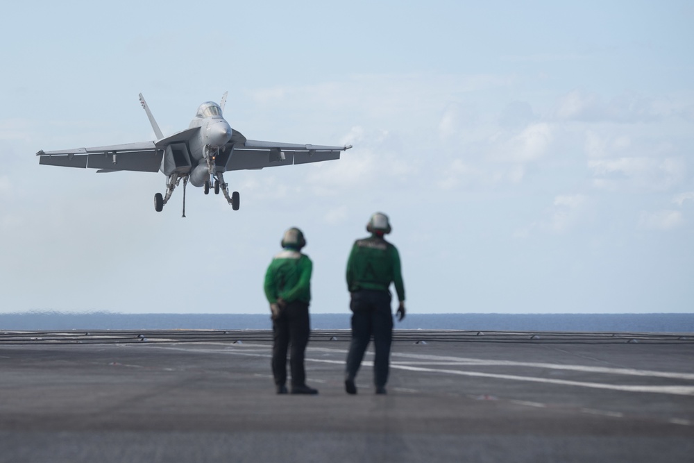 An F/A-18F Super Hornet, assigned to Strike Fighter Squadron (VFA) 106, approaches the flight deck