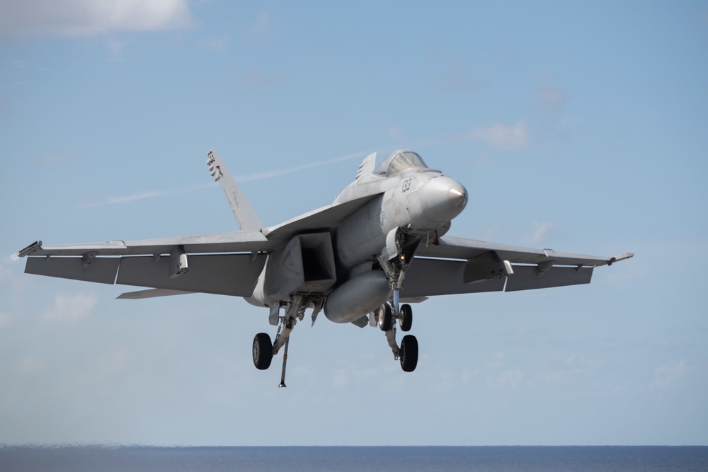 An F/A-18F Super Hornet, assigned to Strike Fighter Squadron (VFA) 106, approaches the flight deck