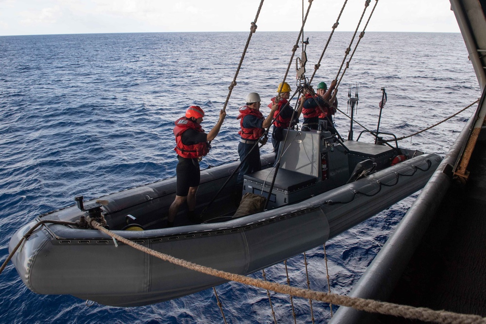 U.S. Sailors get lowered in a RHIB