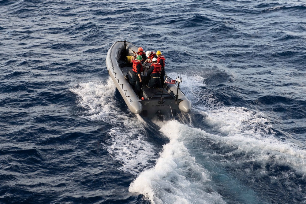 U.S. Sailors prepare operate a RHIB