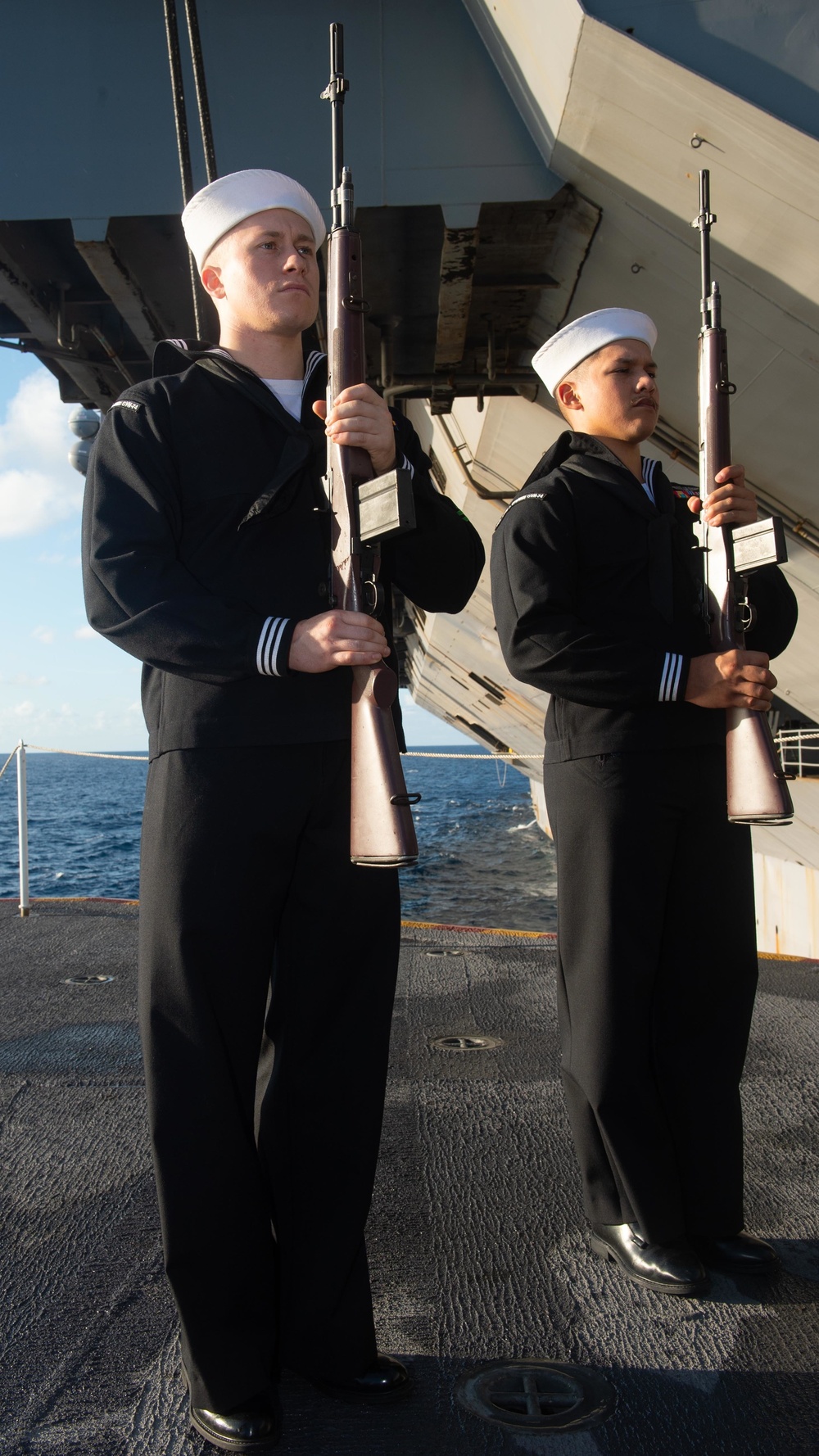 Sailors participate in a Burial at Sea