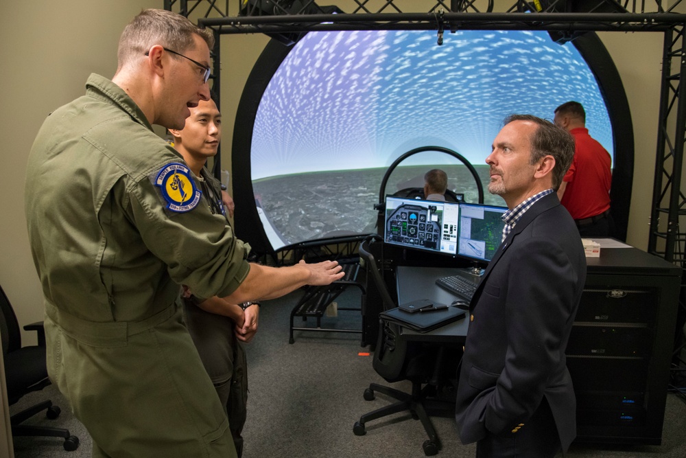 A U.S. Air Force member speaks to Kyle Hybl, El Pomar Foundation president and member of the Air Force Civic Leader Group, Nov. 6, 2019