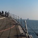 USS Farragut escorts Merchant Vessel Mohawk throught the Straits of Bab el-Mandeb