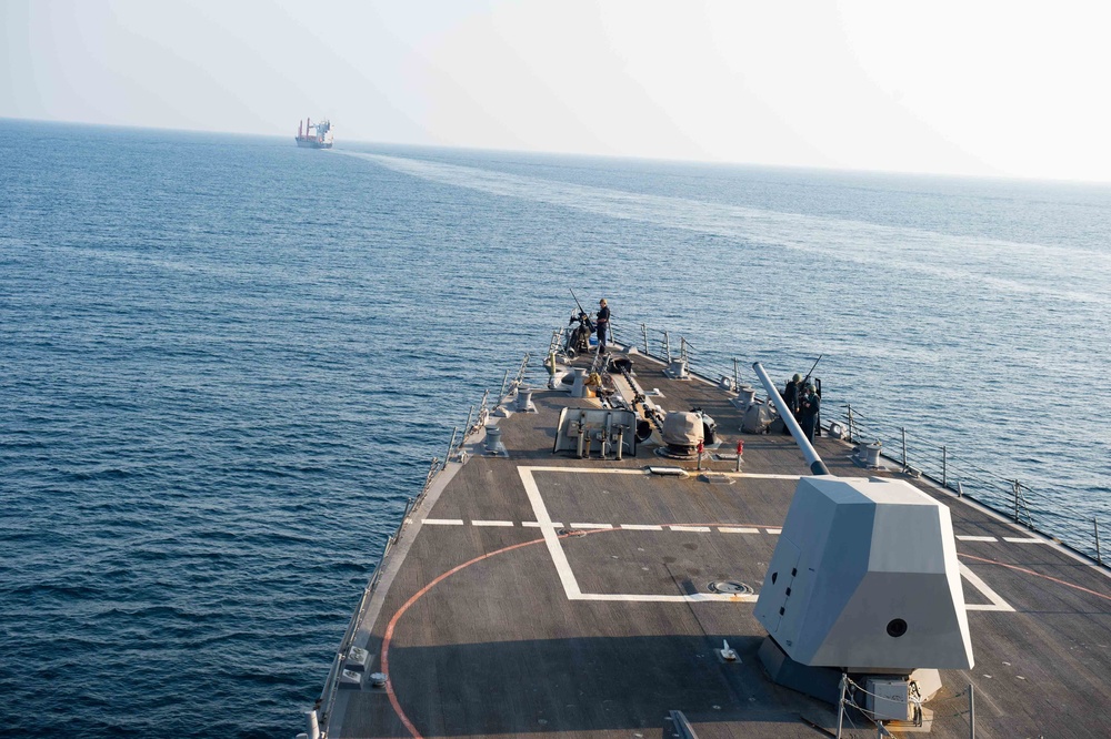 USS Farragut escorts Merchant Vessel Mohawk throught the Straits of Bab el-Mandeb