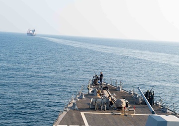 USS Farragut escorts Merchant Vessel Mohawk throught the Straits of Bab el-Mandeb