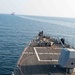 USS Farragut escorts Merchant Vessel Mohawk throught the Straits of Bab el-Mandeb