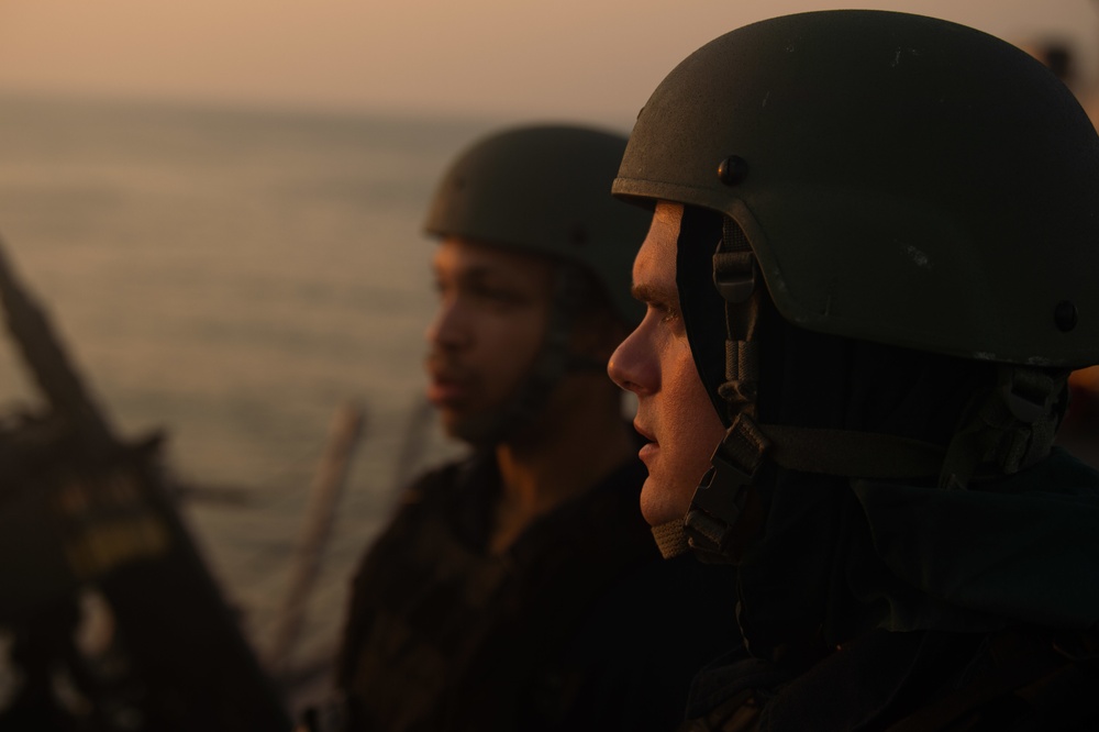 USS Farragut escorts Merchant Vessel Mohawk throught the Straits of Bab el-Mandeb