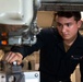 U.S. Sailor tightens hold downs
