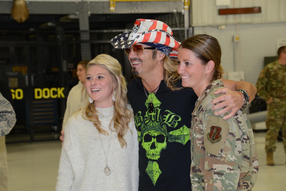 Bret Michaels pose for a photo with 185th fans