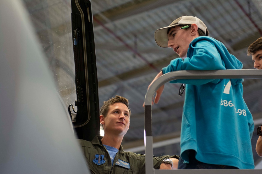 Community partners and students visit the 125th Fighter Wing