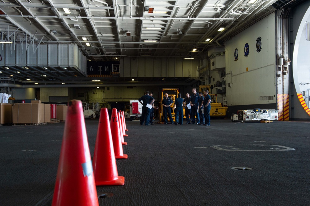 U.S. Navy Sailors drive forklift training course