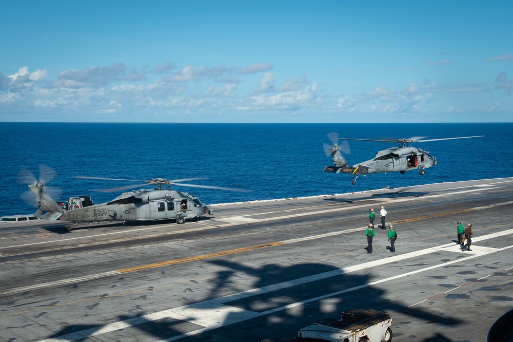 An MH-60S takes off from the flight deck