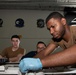 U.S. Sailor conducts maintenance