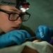 Corpsman performs suture on Marine